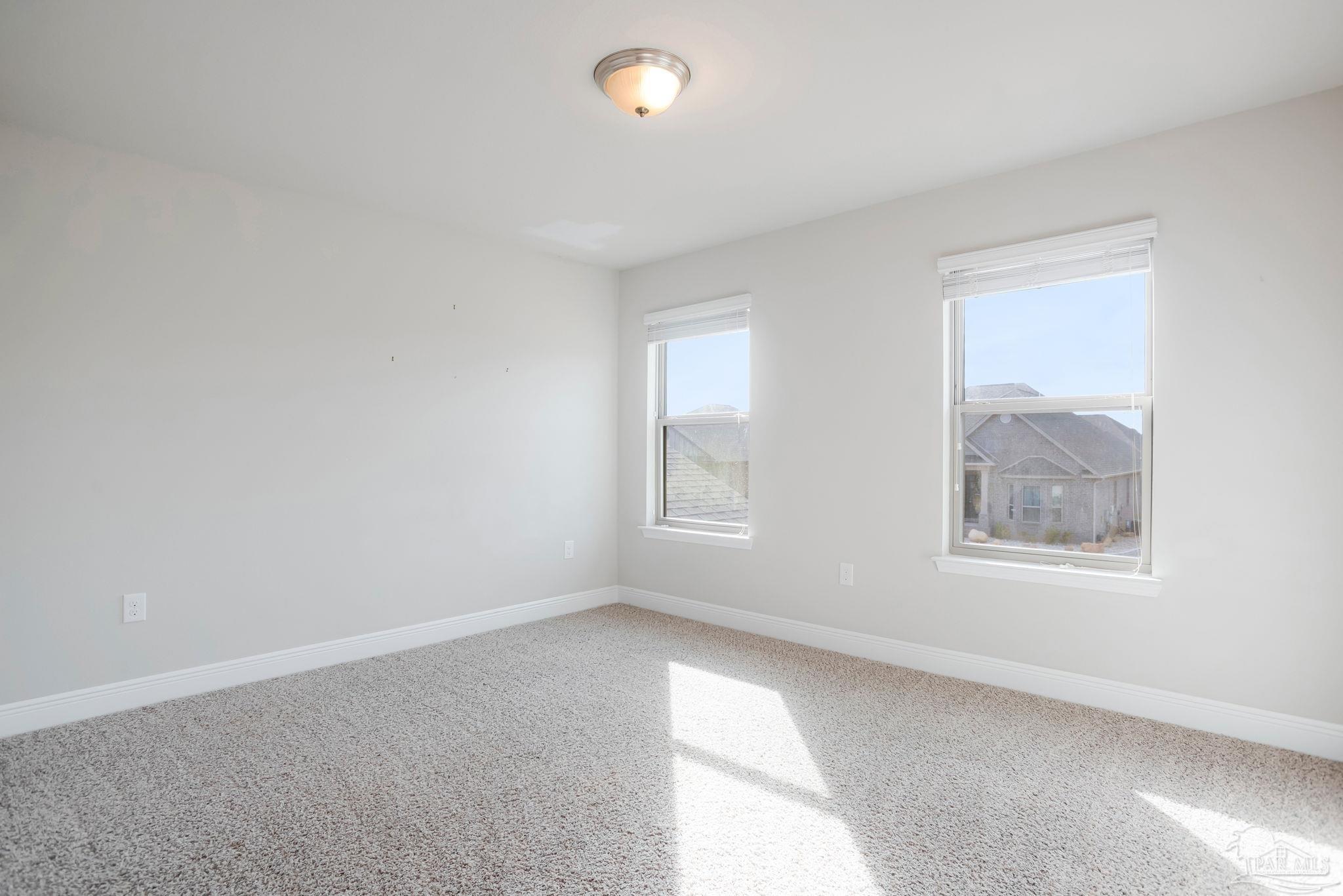 8016 Woodbrook Road Pensacola, FL 32526 - Photo 34 of 52 an empty room with a window