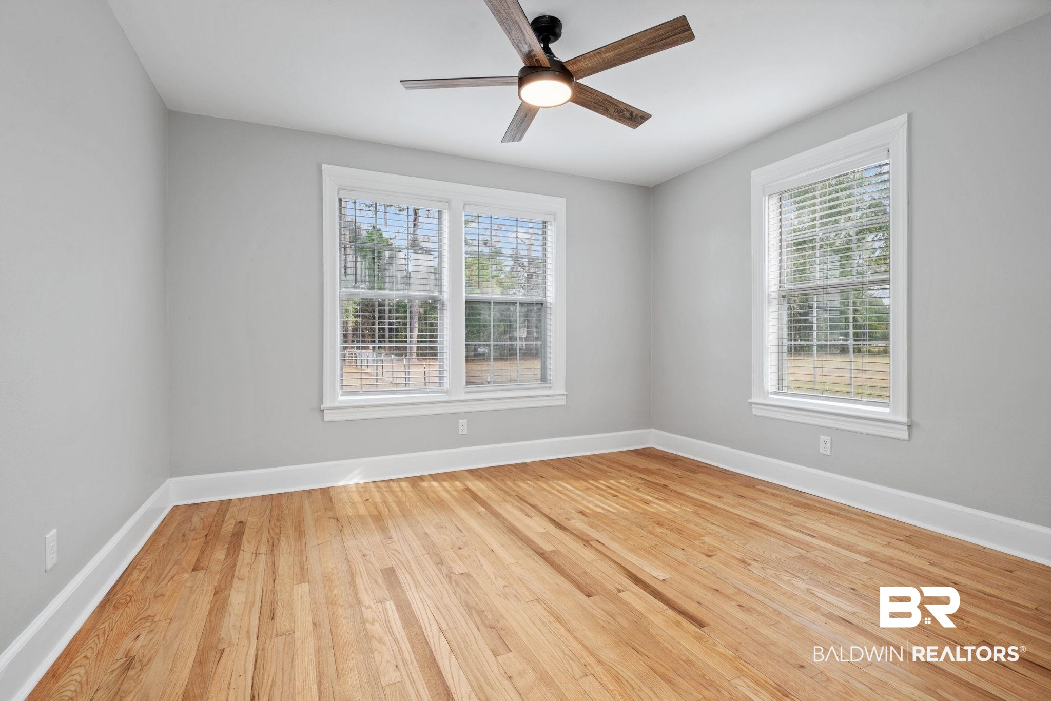 13461 Tom Gaston Road Mobile, AL 36695 - Photo 24 of 41 Unfurnished room with light wood-type flooring, plenty of natural light, and a ceiling fan