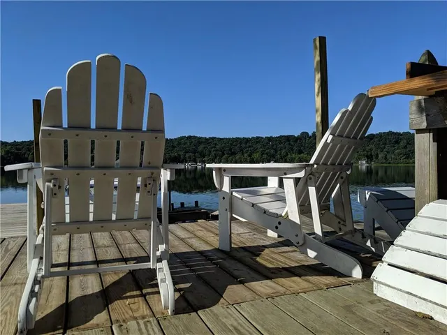 a view of balcony with wooden floor and outdoor seating