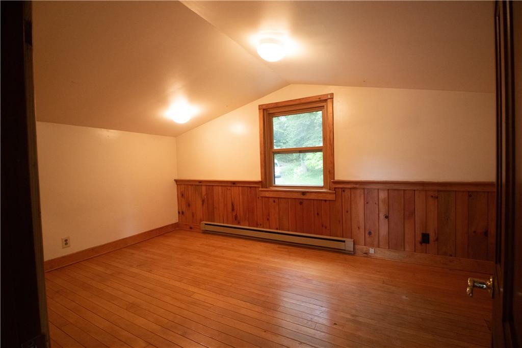 55 Elm St Extension Stoneboro, PA 16153 - Photo 35 of 44 an empty room with wooden floor and windows