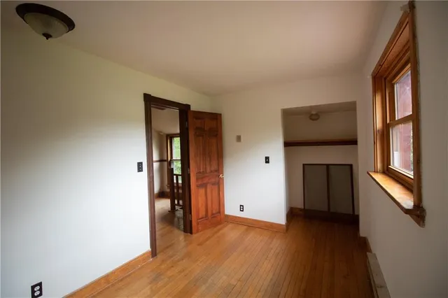 a view of an entryway with wooden floor