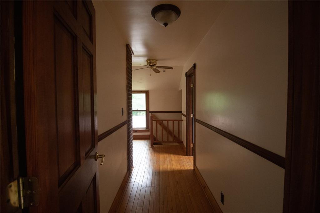 55 Elm St Extension Stoneboro, PA 16153 - Photo 37 of 44 a view of a hallway with wooden floor and staircase