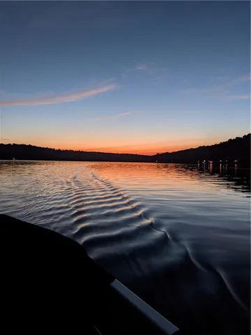 a view of lake and sunset