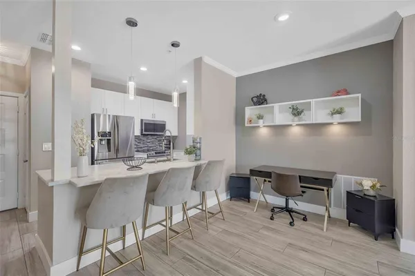 a view of kitchen with breakfast area