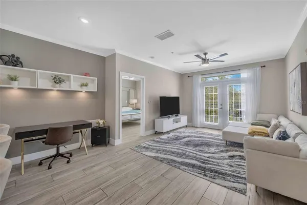 a bedroom with a bed and a desk