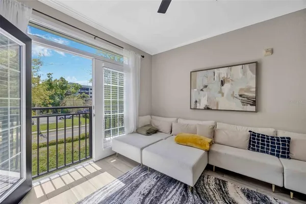 a living room with furniture and a window