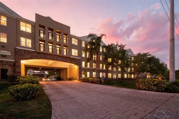 a view of a building with a yard