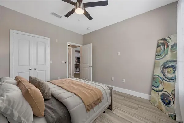 a bedroom with a bed and a window