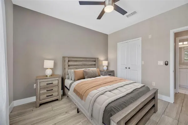 a bedroom with a bed and a tv