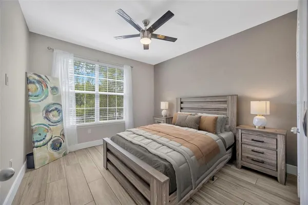 a bedroom with a bed and a window