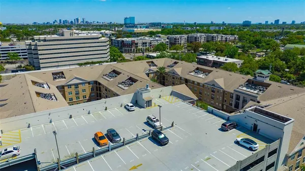 an aerial view of a house with a city view