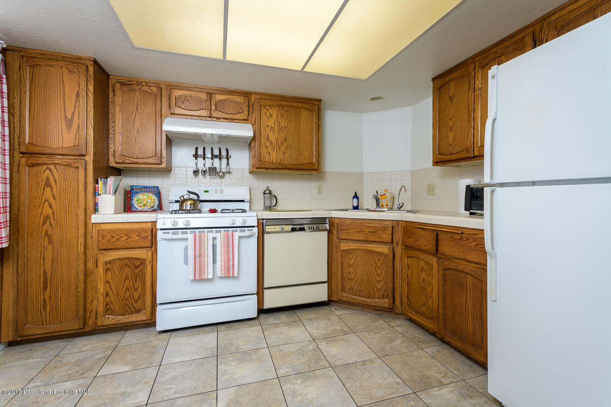 2248 Del Mar Road, Unit 7 Montrose, CA 91020 - Photo 14 of 35 a kitchen with a stove sink and a refrigerator