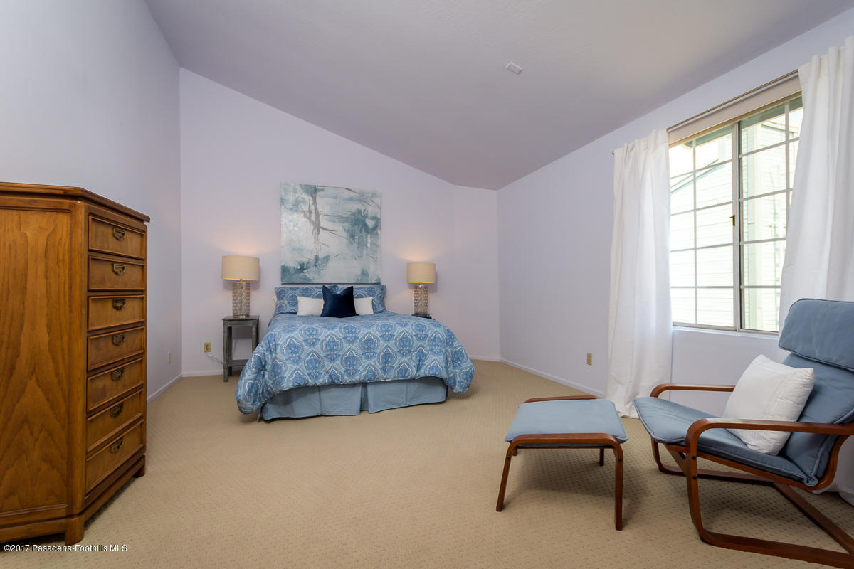 2248 Del Mar Road, Unit 7 Montrose, CA 91020 - Photo 20 of 35 a bedroom with a bed chair and window