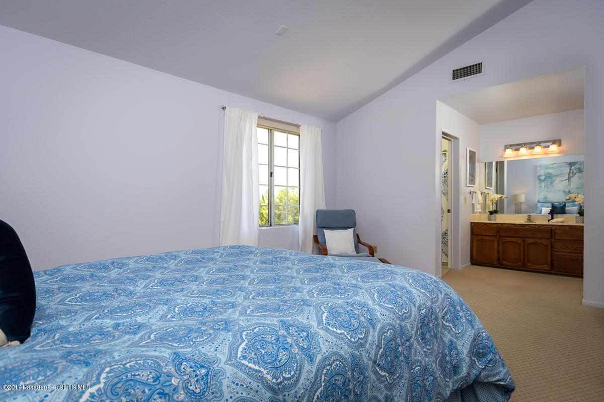 2248 Del Mar Road, Unit 7 Montrose, CA 91020 - Photo 21 of 35 a bedroom with a bed and a couch