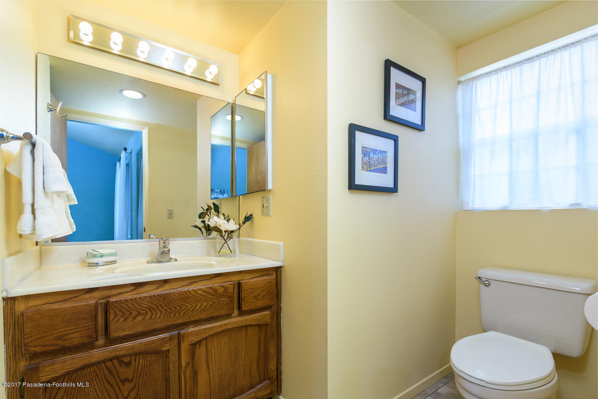 2248 Del Mar Road, Unit 7 Montrose, CA 91020 - Photo 22 of 35 a bathroom with a toilet sink and mirror