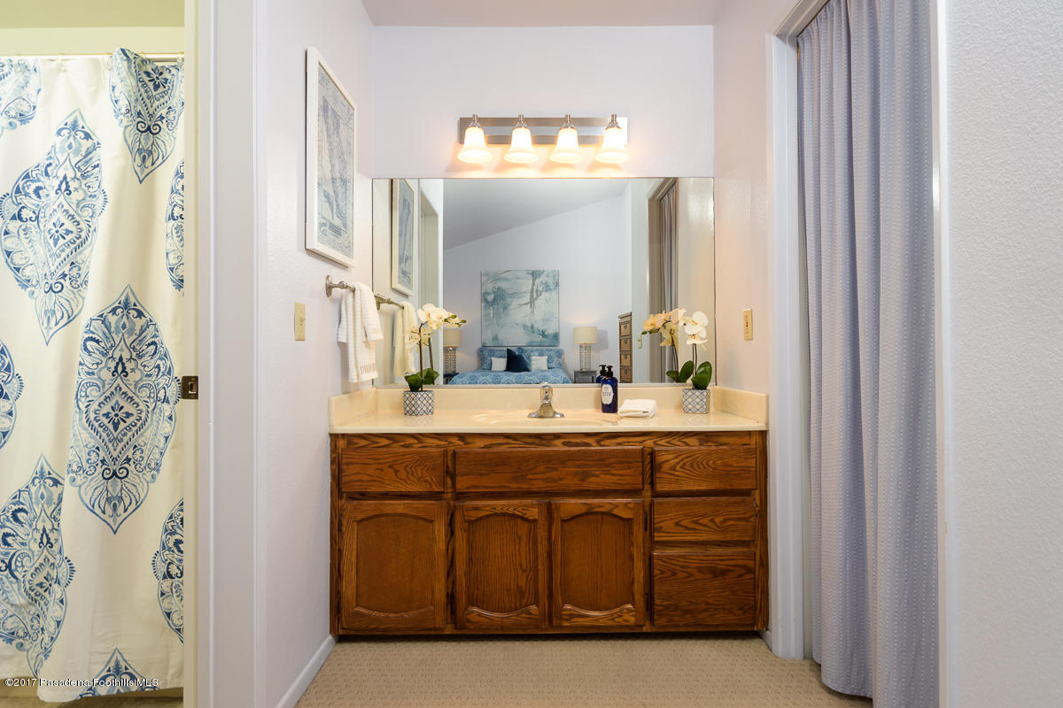 2248 Del Mar Road, Unit 7 Montrose, CA 91020 - Photo 23 of 35 a bathroom with a granite countertop sink a mirror and a bathtub