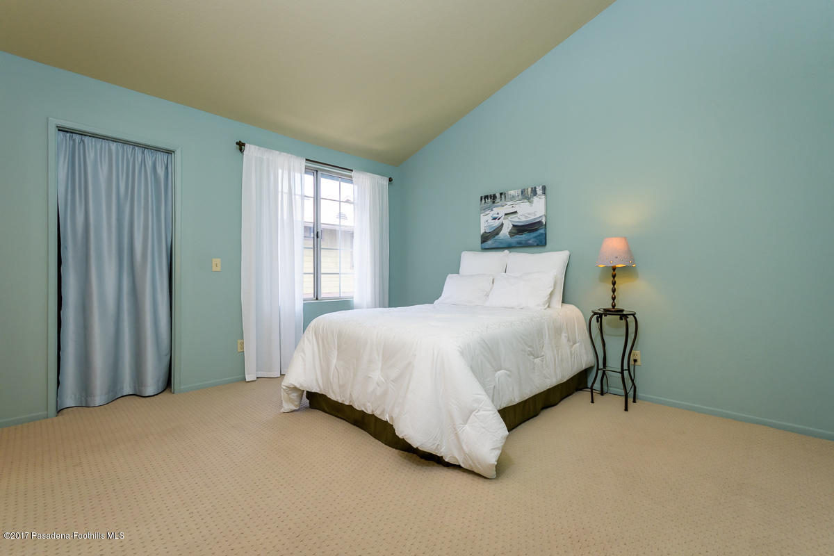 2248 Del Mar Road, Unit 7 Montrose, CA 91020 - Photo 26 of 35 a bedroom with a bed table and a window