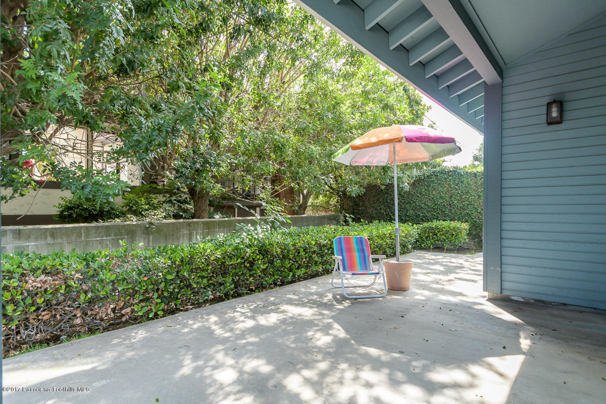 2248 Del Mar Road, Unit 7 Montrose, CA 91020 - Photo 32 of 35 a view of a table and chairs under an umbrella