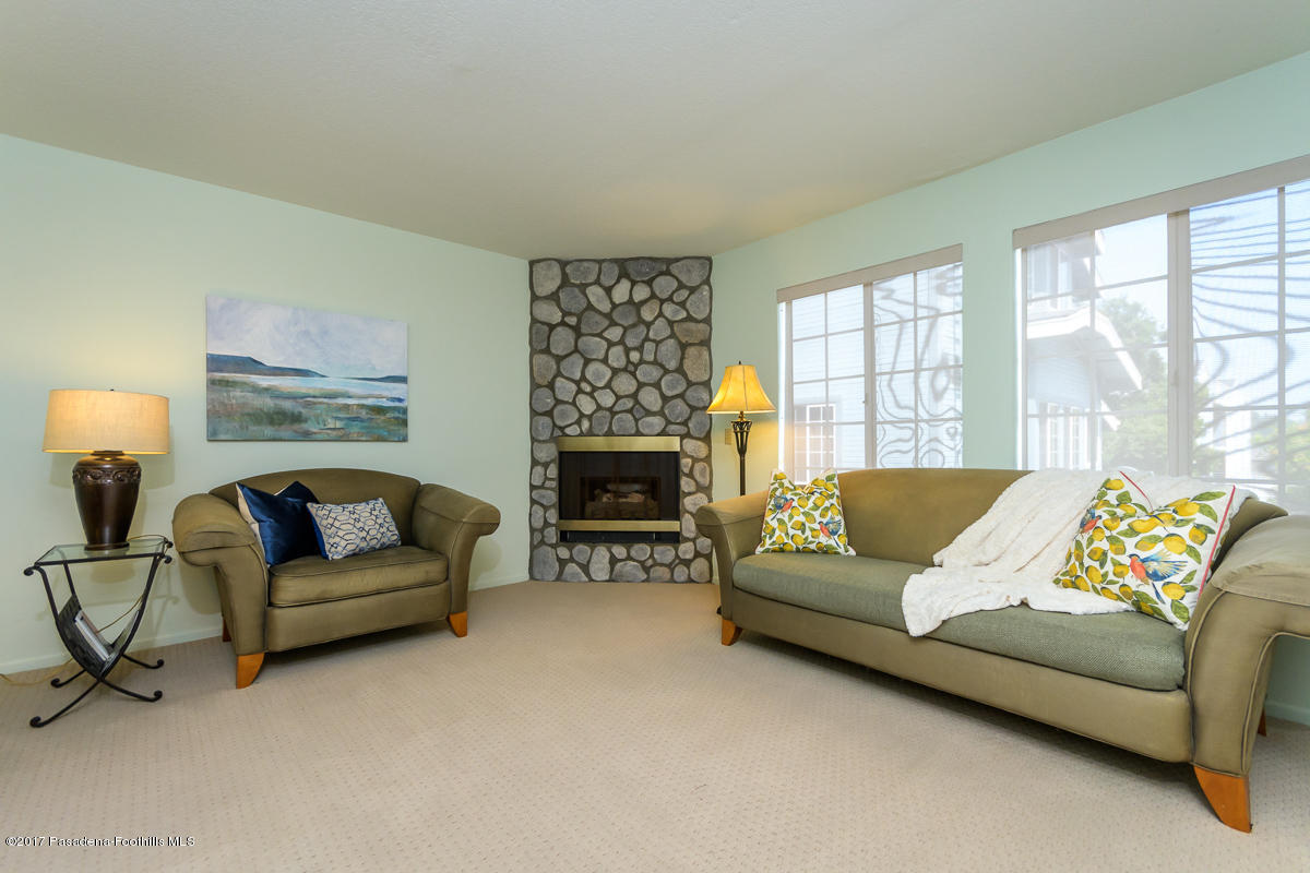 2248 Del Mar Road, Unit 7 Montrose, CA 91020 - Photo 9 of 35 a living room with furniture and a fireplace