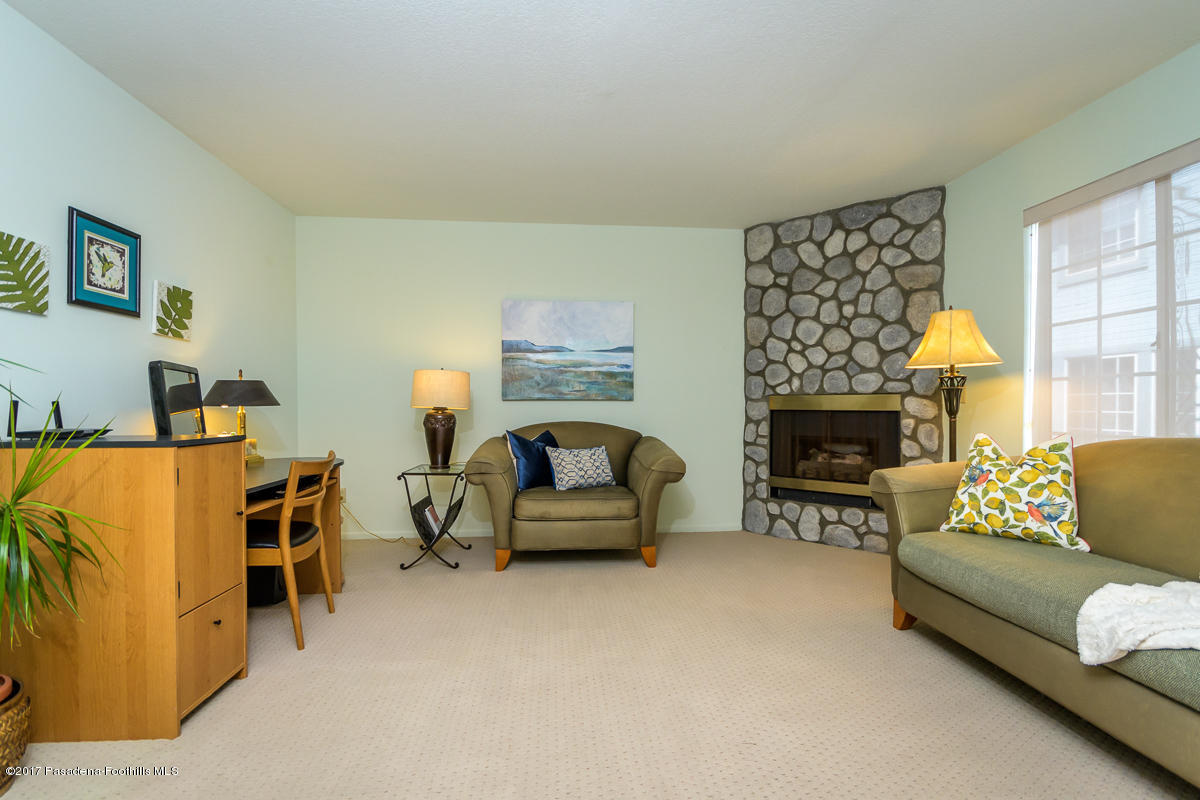 2248 Del Mar Road, Unit 7 Montrose, CA 91020 - Photo 10 of 35 a living room with furniture and a fireplace