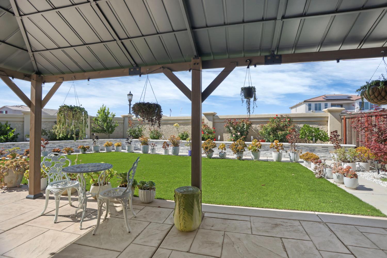 6949 Foraker Drive Stockton, CA 95219 - Photo 31 of 34 a view of a porch with furniture and garden