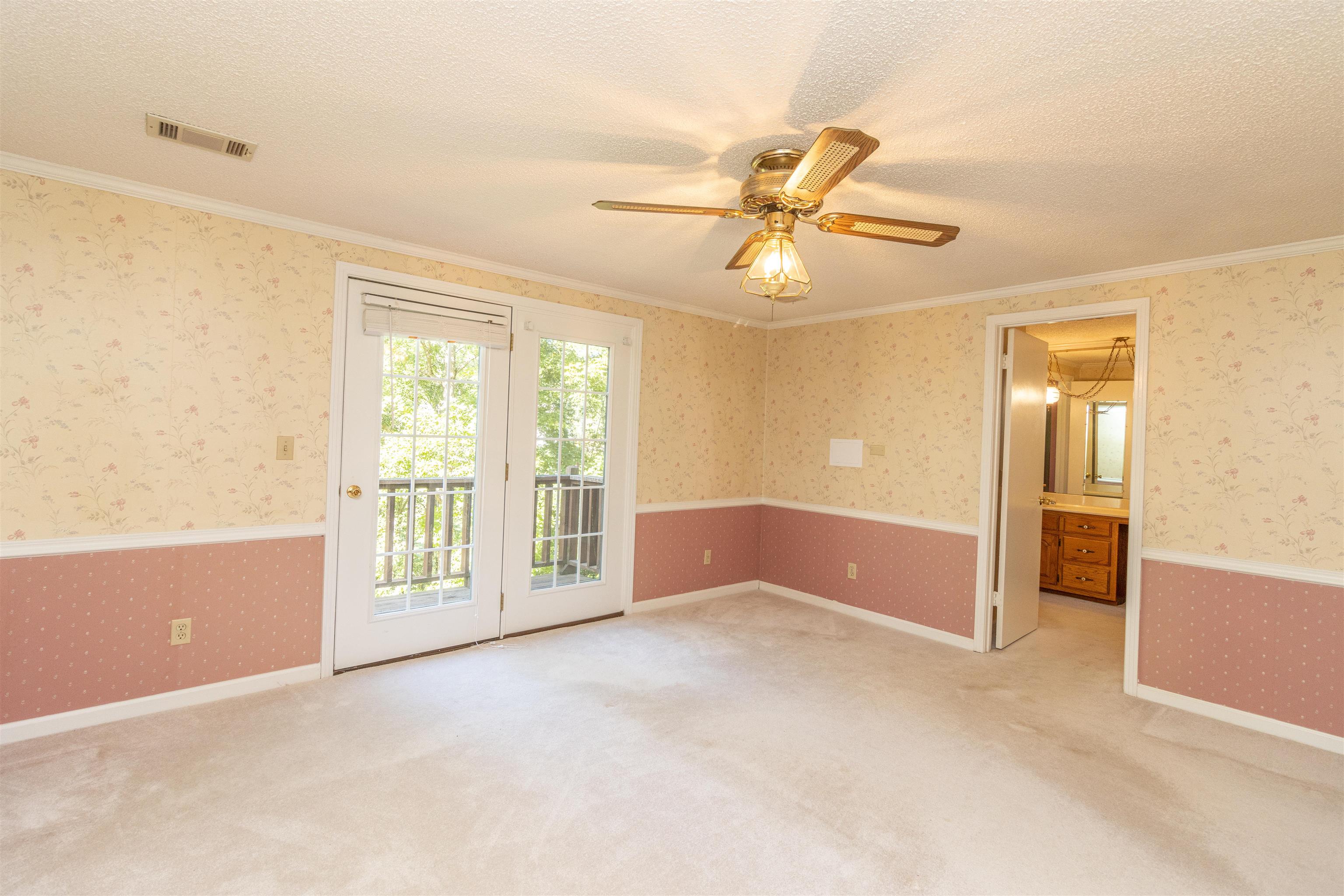 651 Pine Street Adamsville, TN 38310 - Photo 14 of 25 a view of an empty room with a window