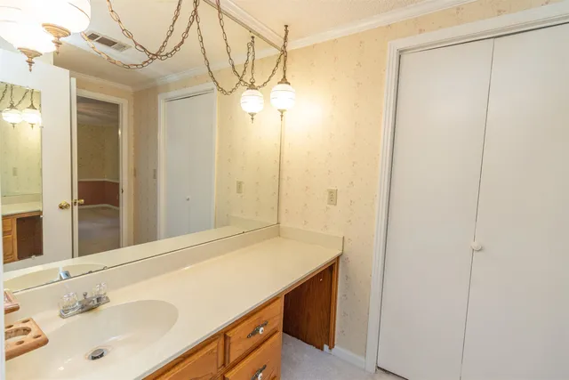 a bathroom with a sink and a mirror