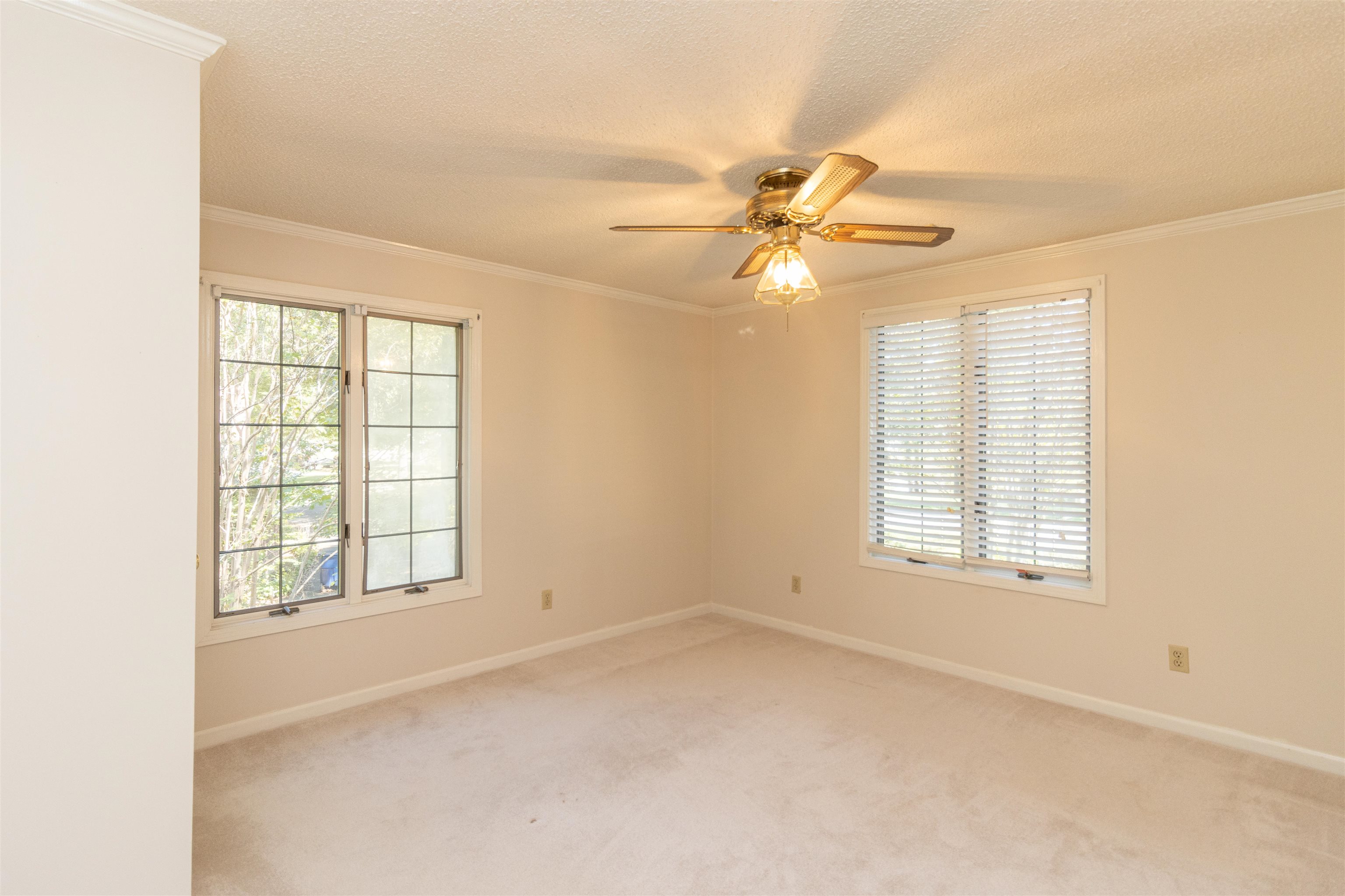 651 Pine Street Adamsville, TN 38310 - Photo 17 of 25 an empty room with windows and fan