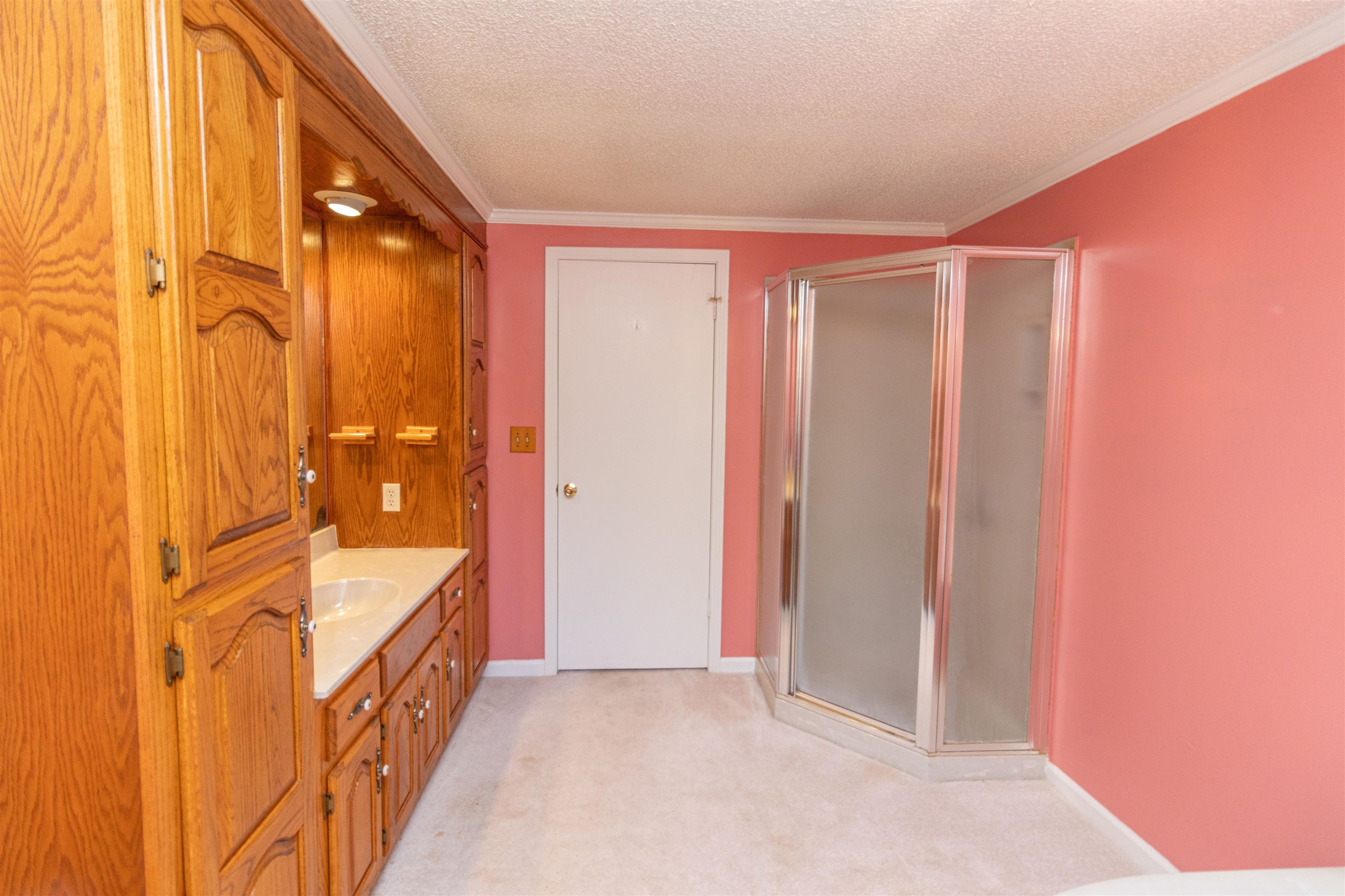 651 Pine Street Adamsville, TN 38310 - Photo 21 of 25 a bathroom with a tub and shower