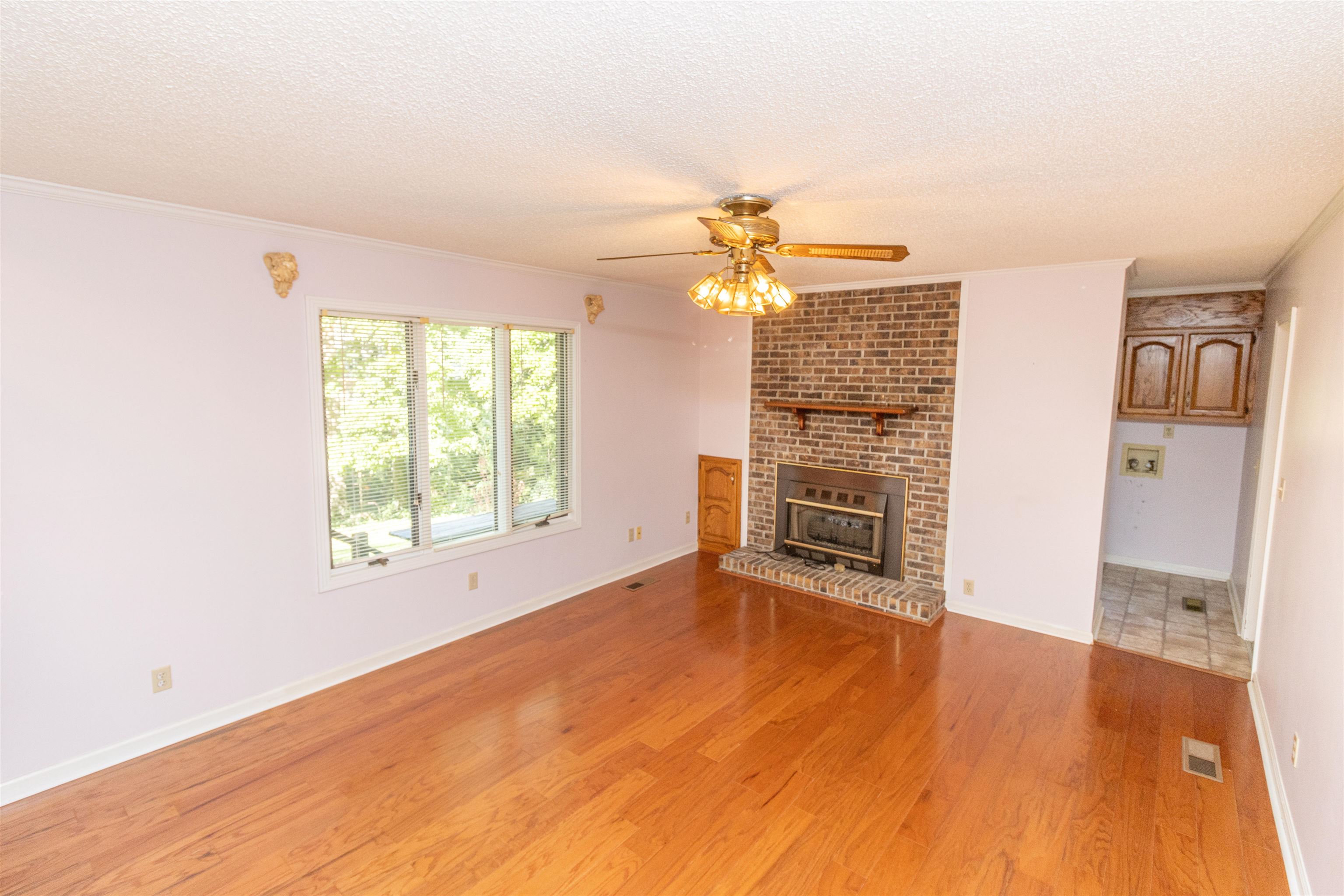 651 Pine Street Adamsville, TN 38310 - Photo 8 of 25 a view of a livingroom with a flat screen tv