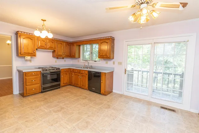 a kitchen with stainless steel appliances granite countertop a stove and a large cabinets
