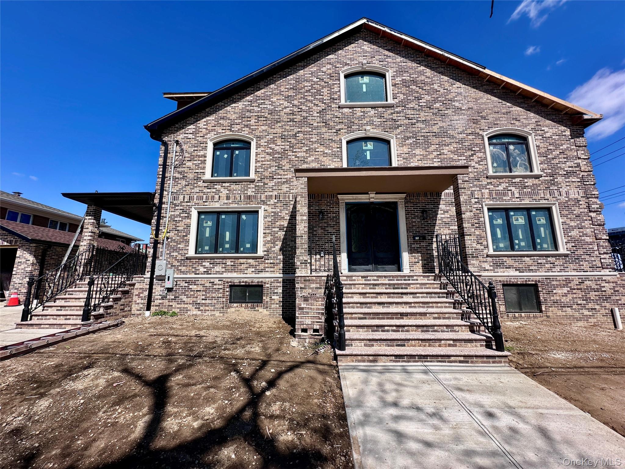 a front view of a house with garage