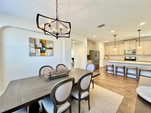 a dining room with furniture and window