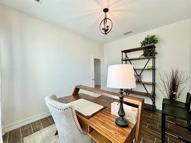 a view of workspace with wooden floor