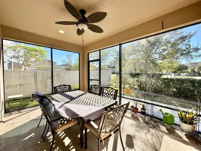 a view of a city from a dining room with large windows