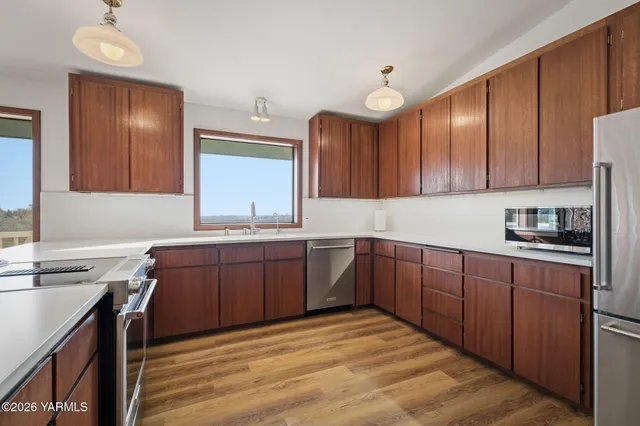 a bedroom with a large bed and a dresser