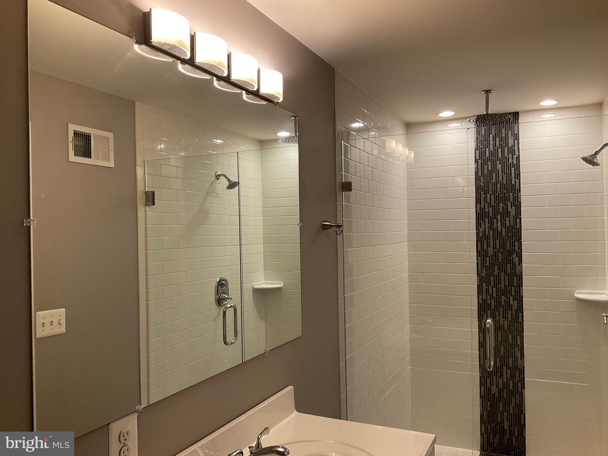 2437 Fleet Street Baltimore, MD 21224 - Photo 25 of 33 a bathroom with a shower and a toilet