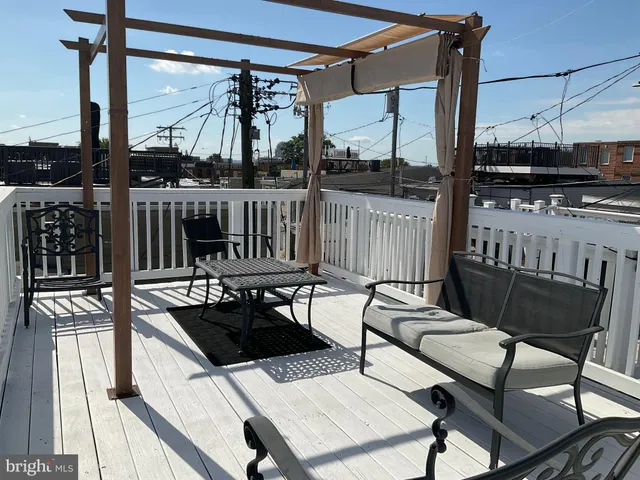 a view of a chairs and table in patio