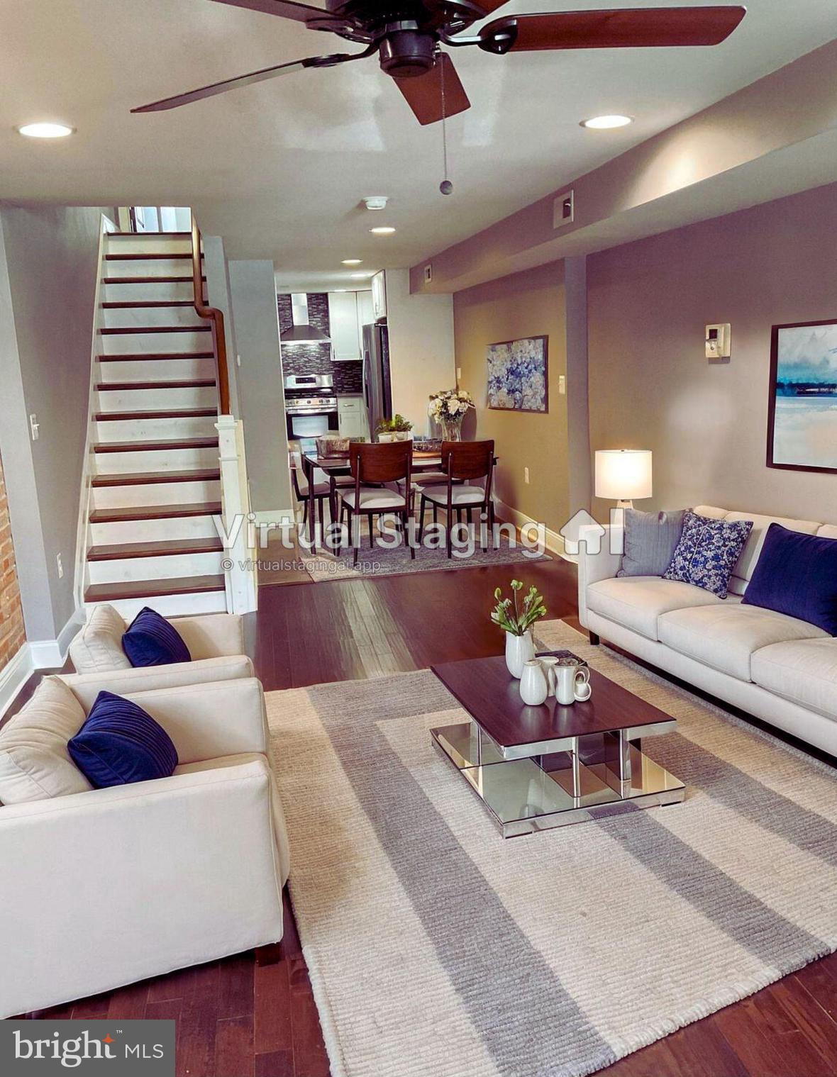 2437 Fleet Street Baltimore, MD 21224 - Photo 5 of 33 a living room with furniture and wooden floor