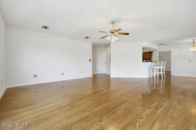 a view of a room with wooden floor and fire pit