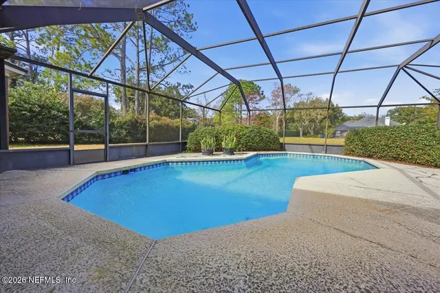 a view of a swimming pool with a patio