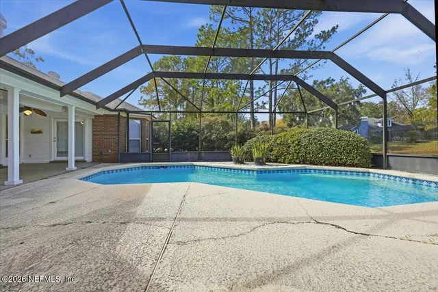 a view of swimming pool with a yard