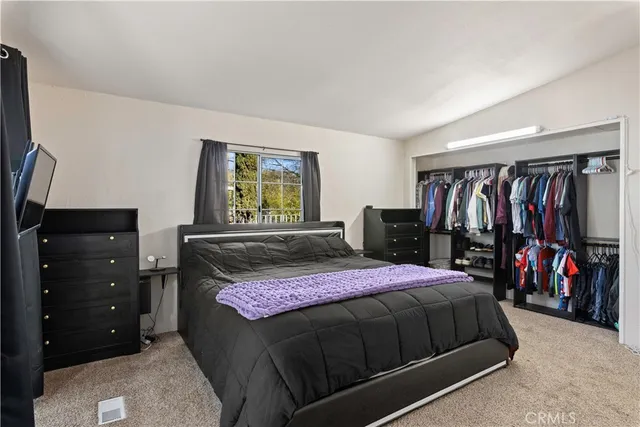 a bathroom with a shower a toilet and sink