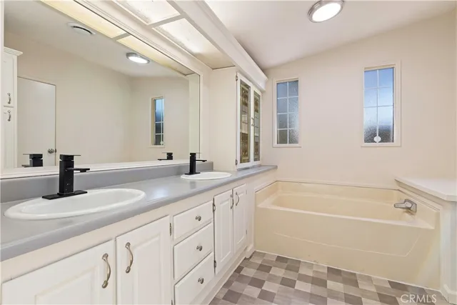 a view of a patio with a table and chairs