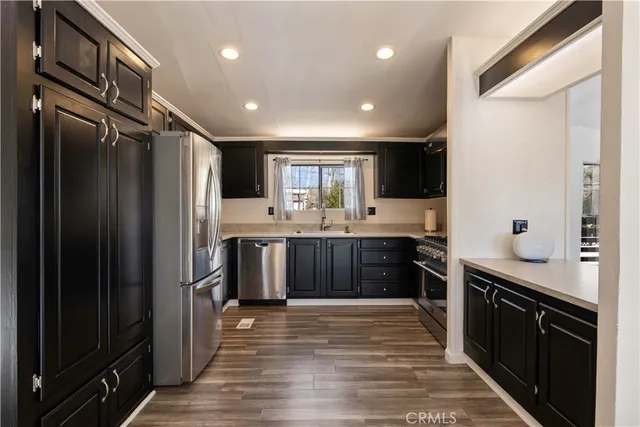 a kitchen with a stove and a sink