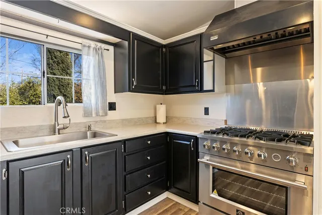a kitchen with a refrigerator and a sink