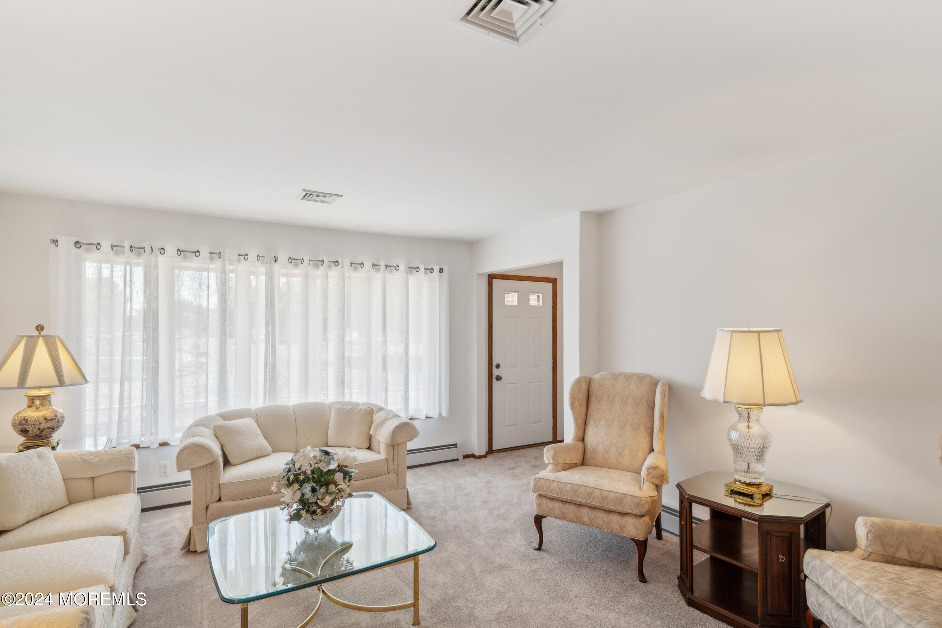 3 Garrett Road Toms River, NJ 08757 - Photo 3 of 24 a living room with furniture a lamp and a large window