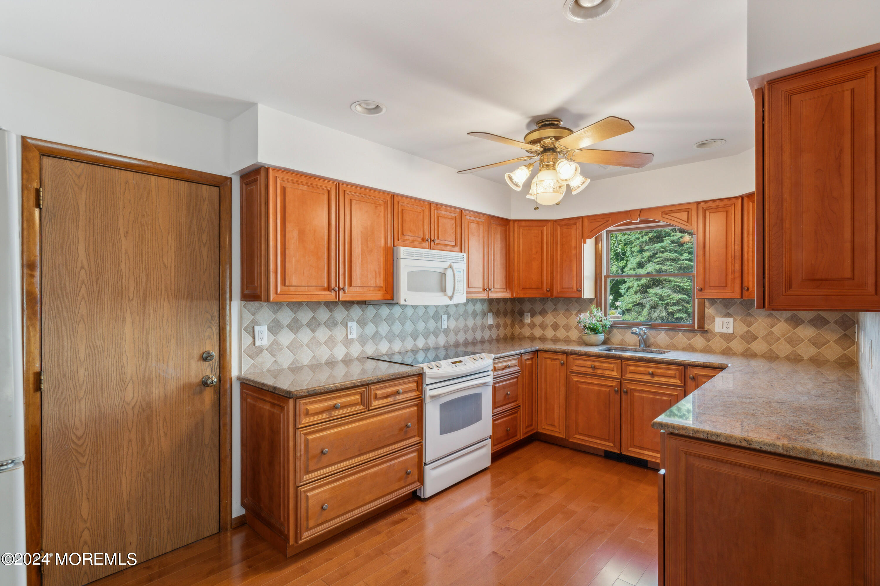 3 Garrett Road Toms River, NJ 08757 - Photo 8 of 24 a kitchen with stainless steel appliances granite countertop a stove a sink and a refrigerator