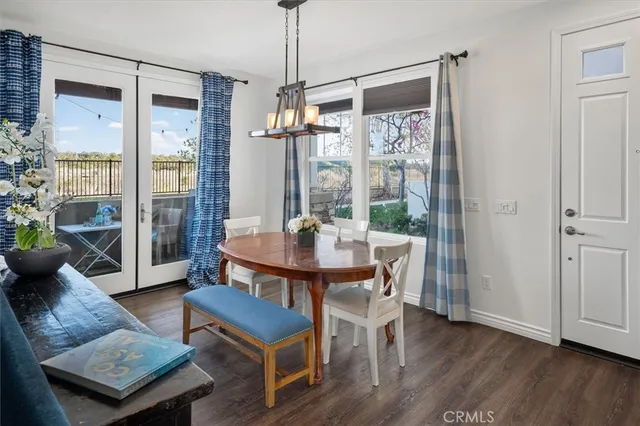 a living room with furniture a table and a chandelier