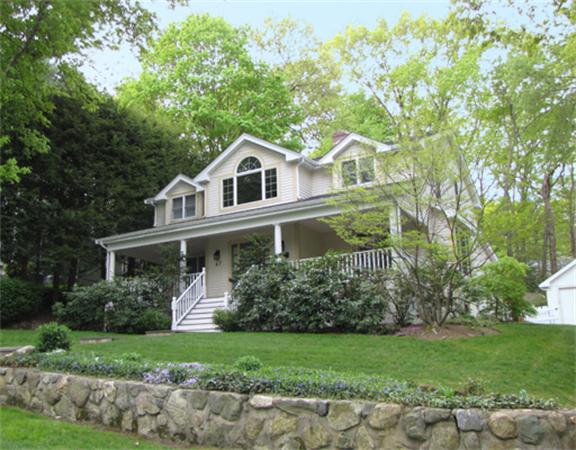 67 Brook Street Wellesley, MA 02482 - Photo 1 of 14 a front view of a house with a garden
